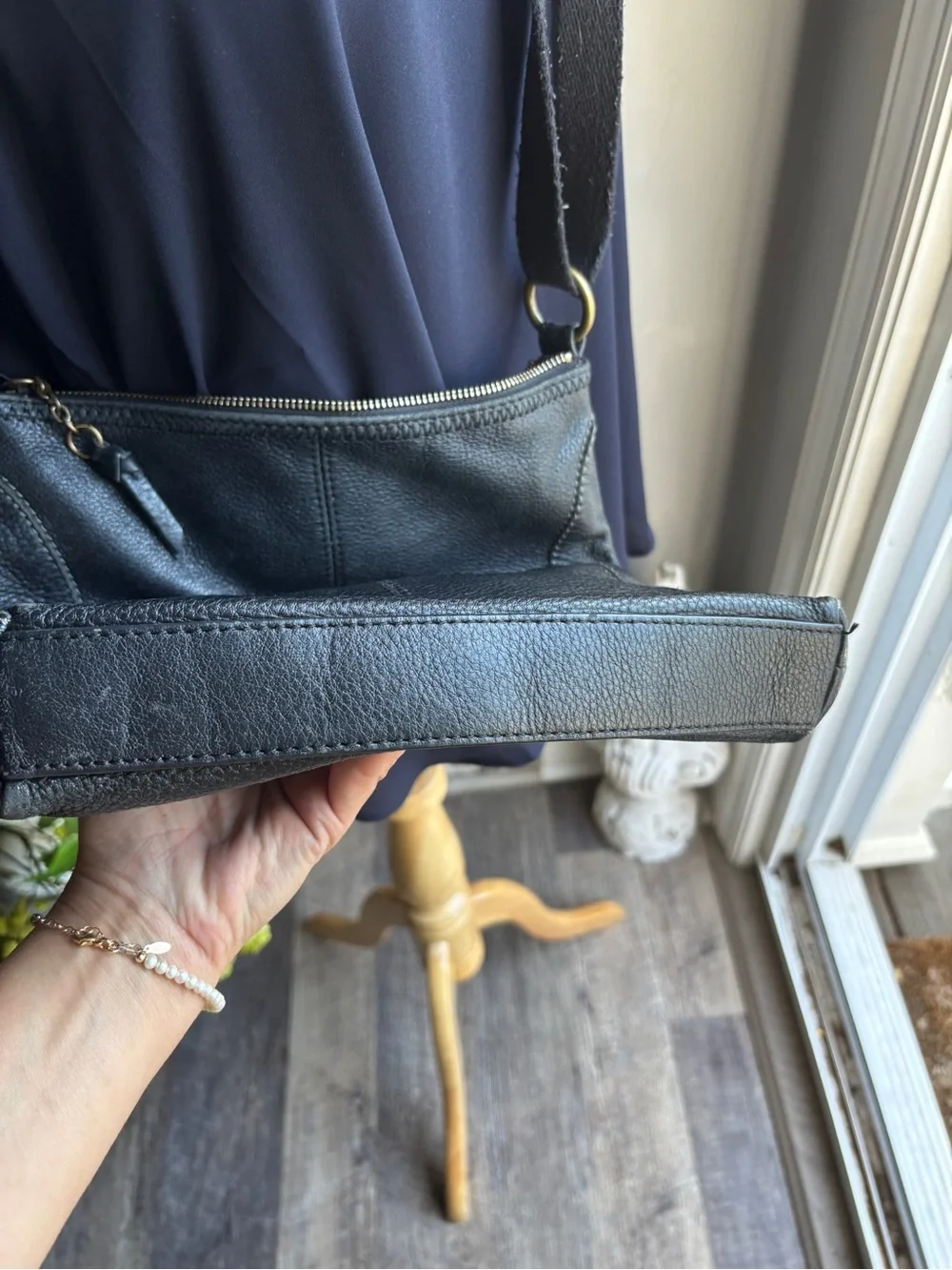 The Sak Black Leather Pebbled Crossbody with Gold Accents